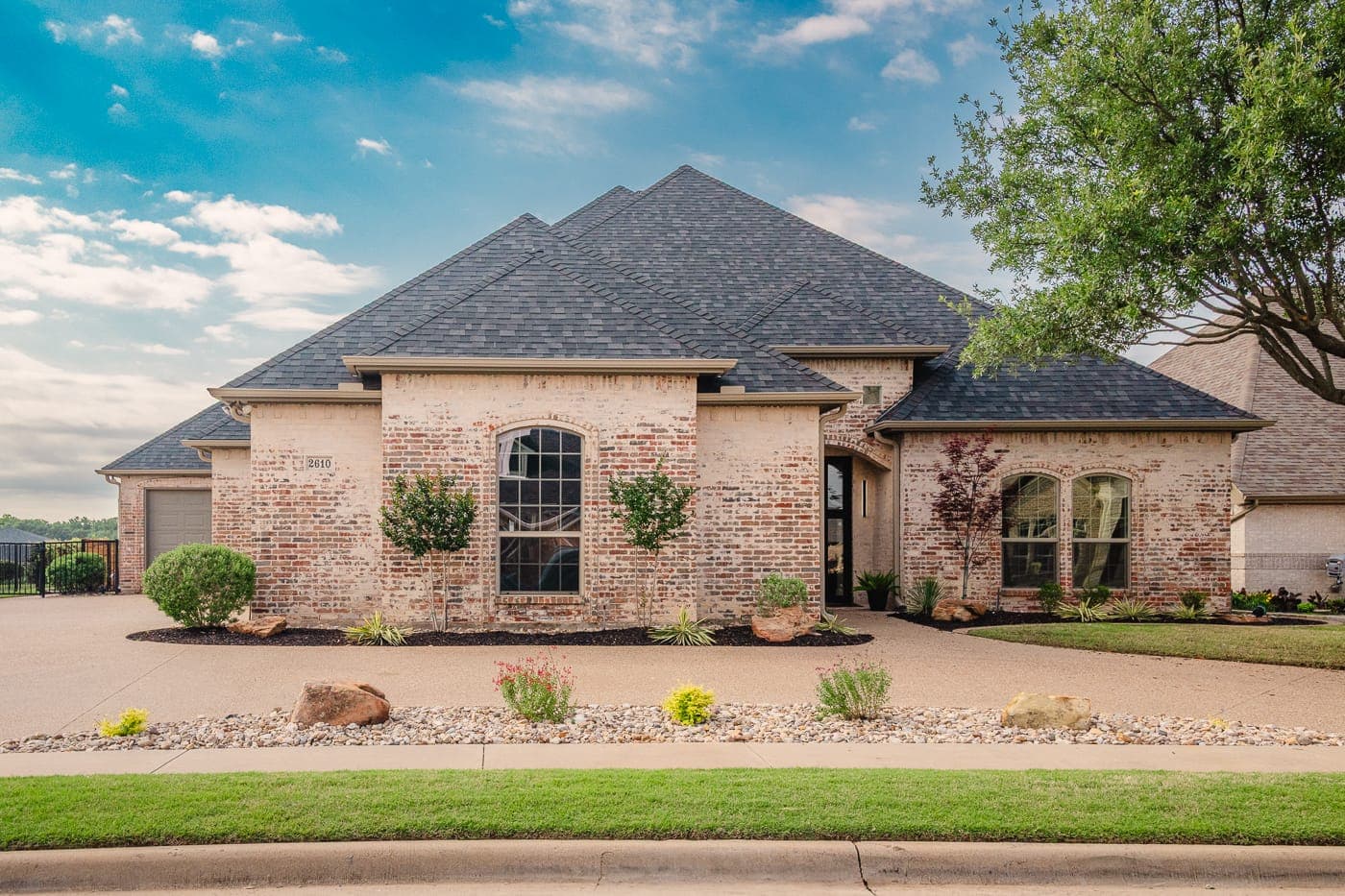 Front elevation of a brick home after a whole-house renovation