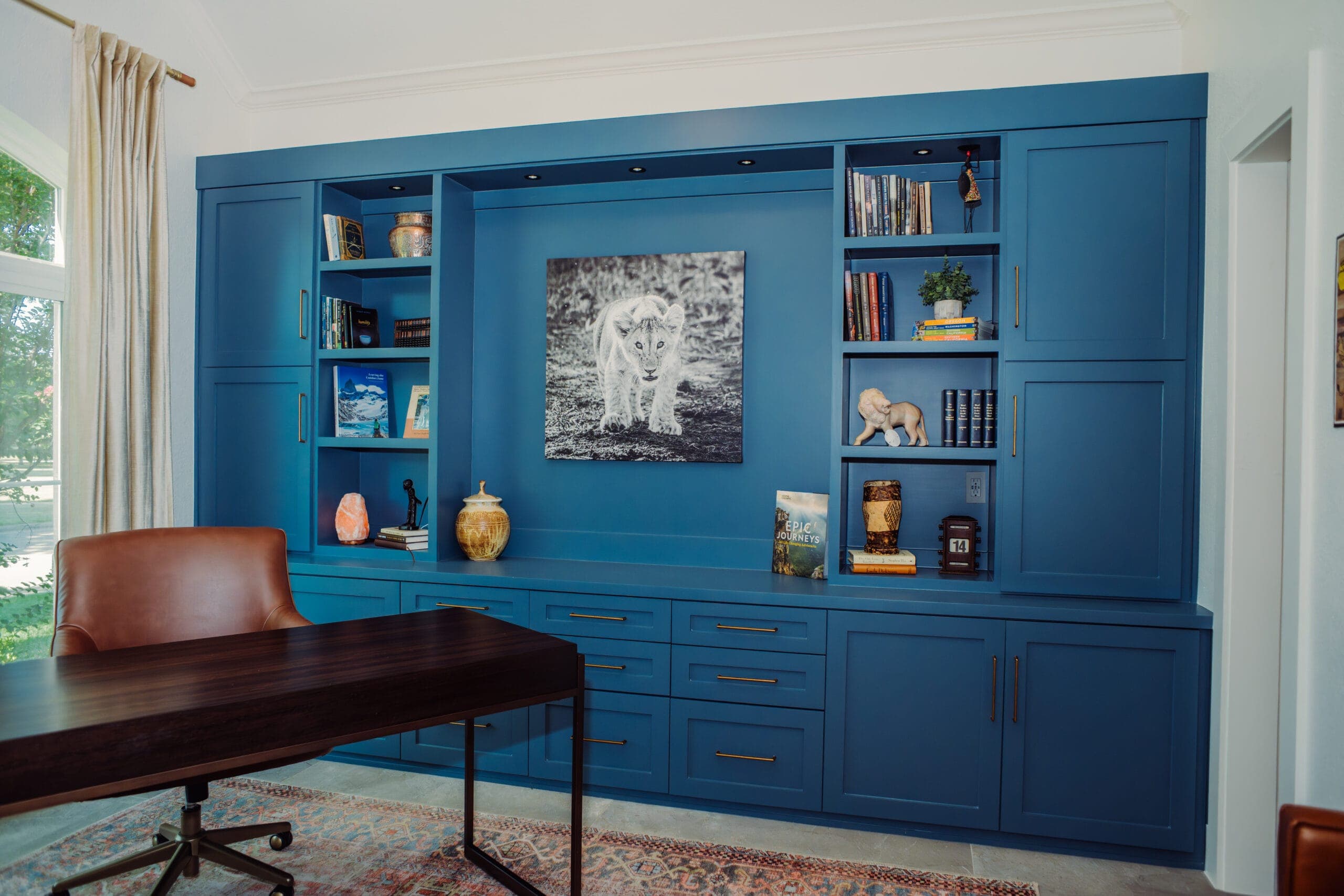 Home office with a full built-in cabinetry wall and desk — home remodeling by Southlake Luxury Kitchens, serving Southlake, TX