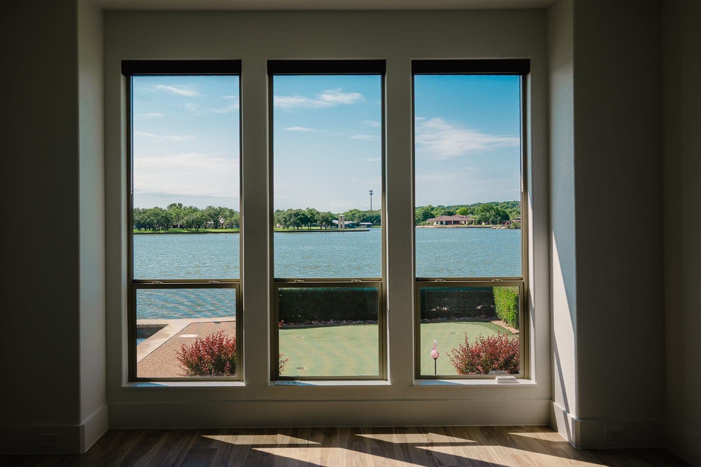 Renovated room with a window wall looking out over the water